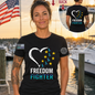 Nautical Salute Heart Freedom Fighter black District Perfect Tri Tee mockup showing front back placement on marina sunset background