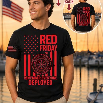 Man wearing a black t-shirt with 'Red Friday' and 'Remember Everyone Deployed' text, standing by a waterfront.